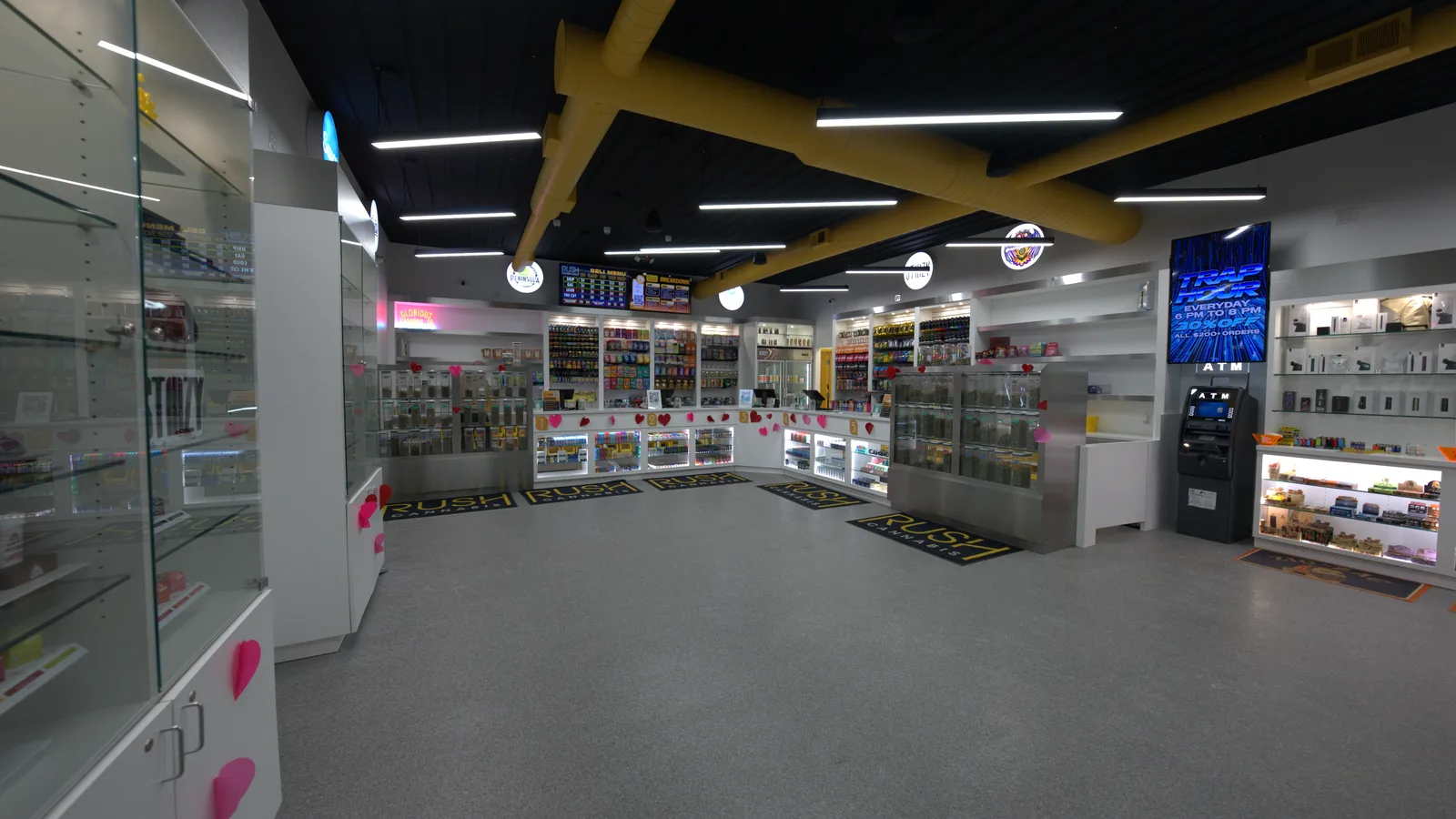 The RUSH Cannabis Oxford sales floor, with lit product displays overhead
