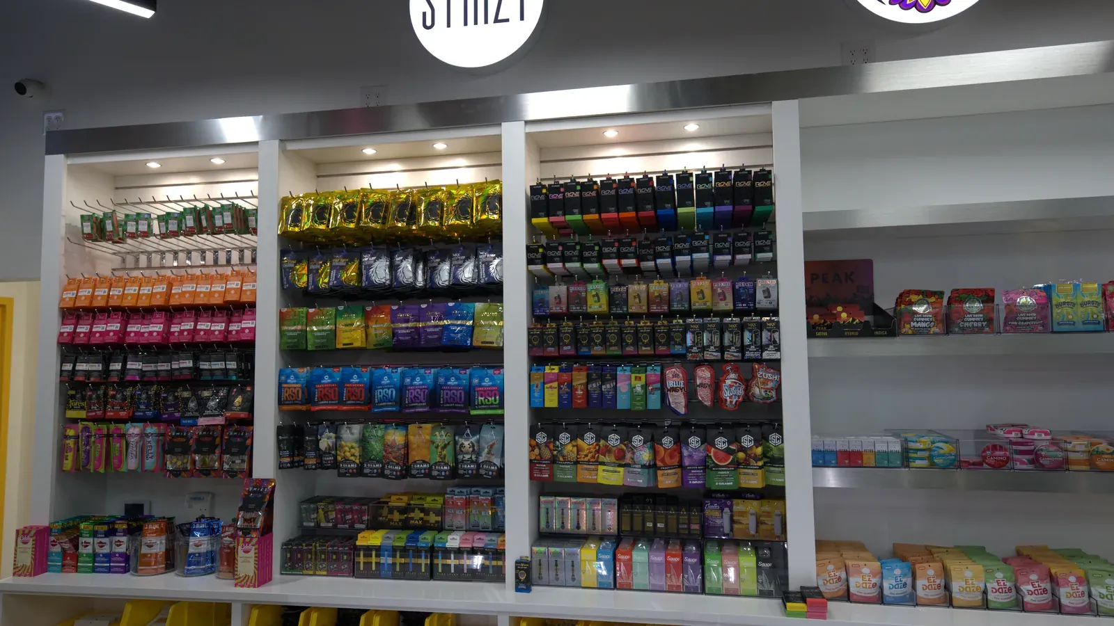 A fully stocked product wall at RUSH Cannabis Oxford